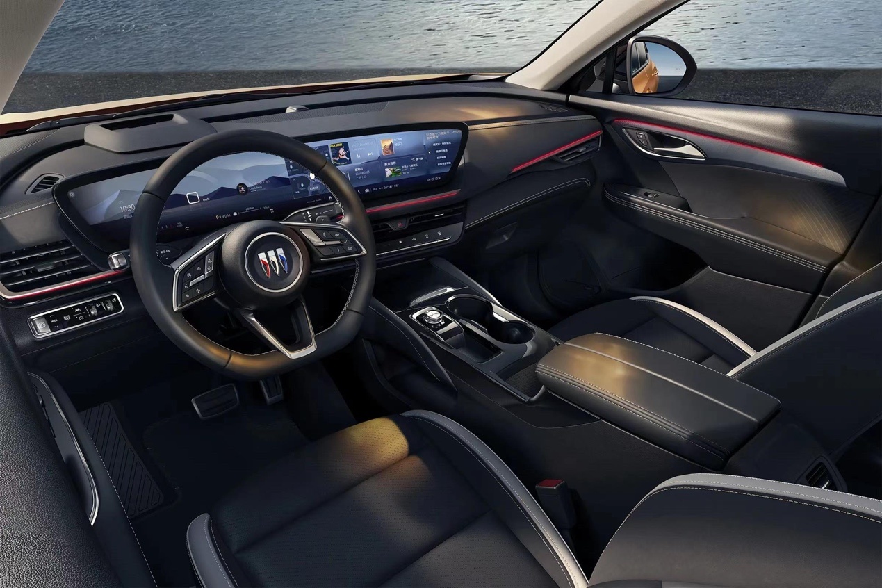 The steering wheel of a car.The description has been automatically generated